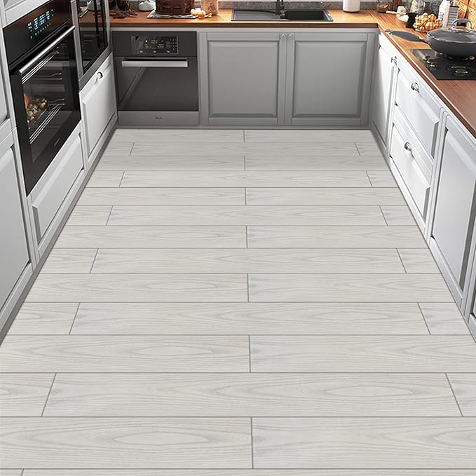 Bathroom with water-resistant laminate flooring, suitable for moist environments.