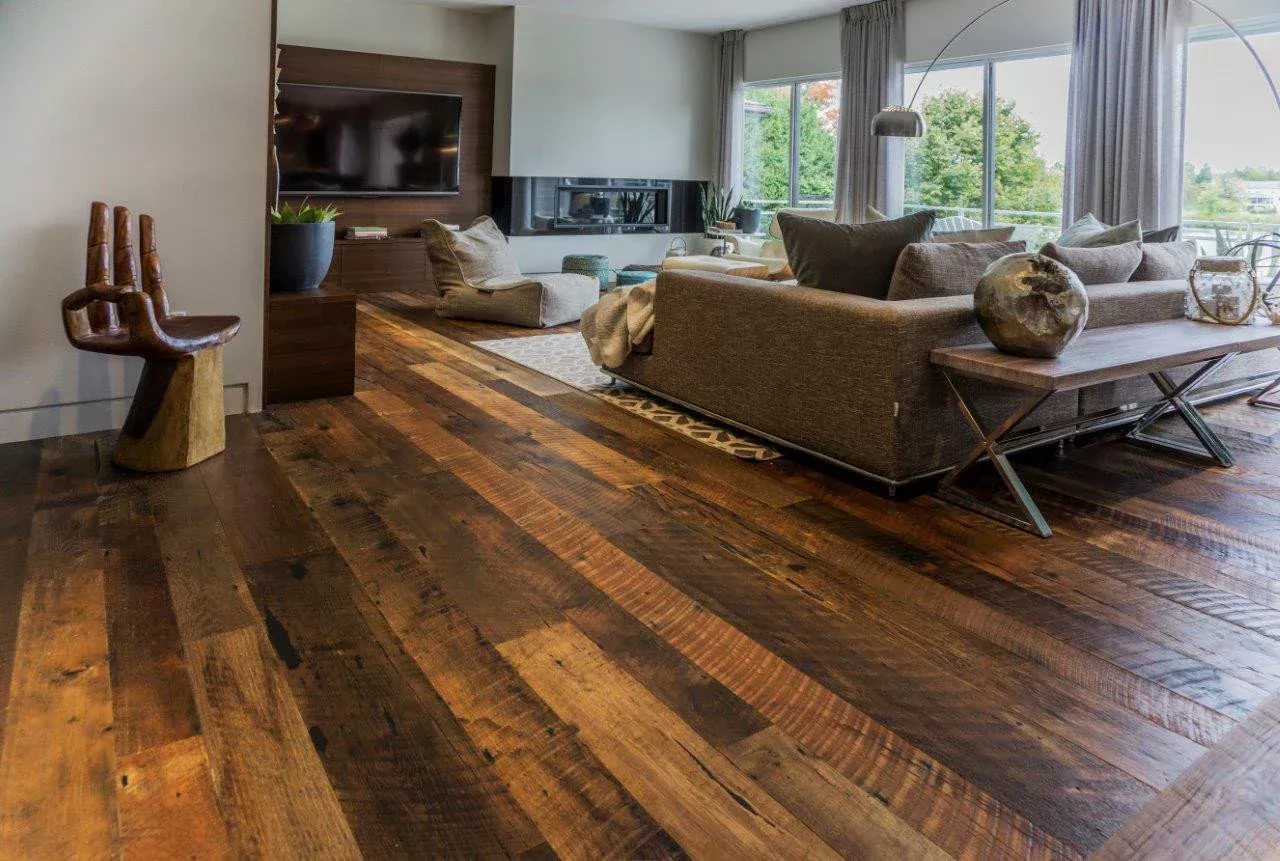 Open-plan room with wide plank laminate flooring creating a spacious feel.